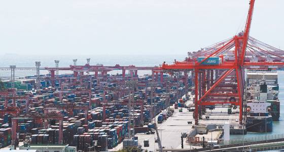 Shipping containers are stacked at a port in Busan. [NEWS1]