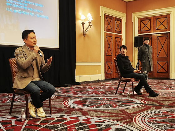 Kim Dong-hyun, left, vice president of SK USA, talks to the Korean press on Sunday at a hotel in Las Vegas prior to the official opening of CES 2024 on Tuesday. [SK GROUP]