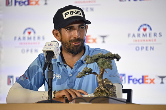 Matthieu Pavon of France speaks to the media after winning the Farmers Insurance Open at Torrey Pines South Course on Jan. 27 in La Jolla, California. [GETTY IMAGES]
