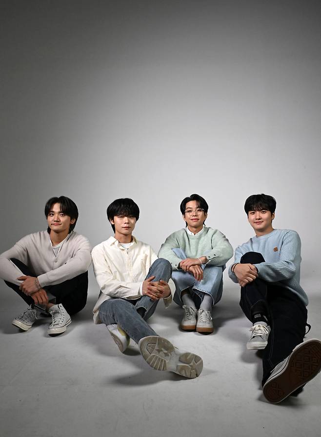 From left: Members of band Lucy, Cho Won-sang, Shin Ye-chan, Choi Sang-yeop and Shin Gwang-il pose for a photo during an interview with The Korea Herald, Jan. 15. (Lee Sang-sub/The Korea Herald)