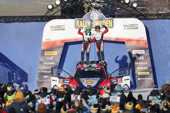 Esapekka Lappi, right, and Janne Ferm of the Hyundai World Rally Team pose after winning in the second round of the 2024 World Rally Championship, which took place between Feb. 15 and 18 in Umeå, Sweden. [HYUNDAI MOTOR]