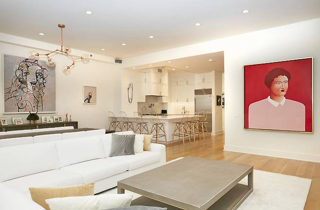 Linda Rosen's living room shows paintings by George Condo and Nicholas Party. (Paul Roh)