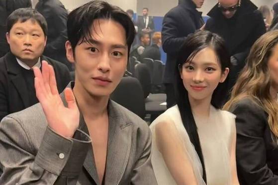 aespa's Karina, right, and actor Lee Jae-wook at Prada's 2024 Fall/Winter Men's Collection fashion show in Milan on Jan. 14. [PRADA]