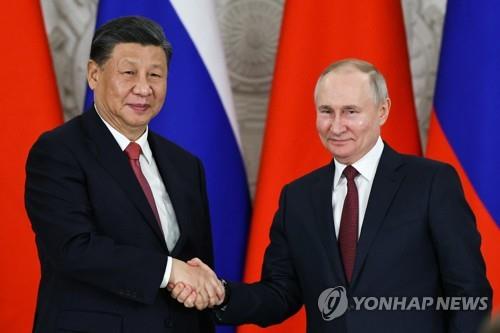 왼쪽부터 시진핑 중국 국가주석, 푸틴 러시아 대통령 [타스=연합뉴스 자료사진. 재판매 및 DB 금지]