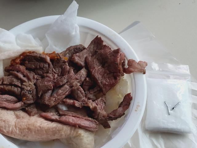 A photo of cooked beef and broken metal pins shared on an online community (Bobaedream)