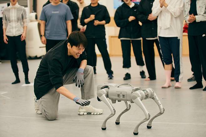 Actors rehearse a scene from “A Thousand Blues” alongside a quadruped robot, GO2, developed by Unitree Robotics. (Seoul Performing Arts Company)
