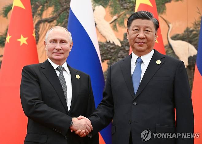 작년 10월 베이징에서 만난 푸틴 대통령과 시진핑 국가주석 [타스 연합뉴스 자료사진 재판매 및 DB 금지]