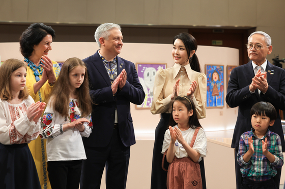 First lady Kim Keon Hee, second from right, attends an exhibition by Ukrainian children held at the Blue House compound in central Seoul on Tuesday. [PRESIDENTIAL OFFICE]