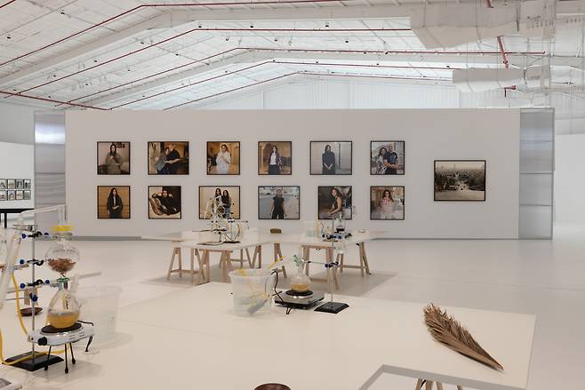 An installation view of "Women of Riyadh" (2023) by Christine Fenzl, in the background, at Diriyah Contemporary Art Biennale 2024 in Diriyah, Saudi Arabia. (Alessandro Brasile/Diriyah Biennale Foundation)