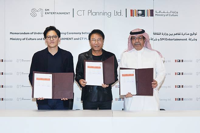 From left: SM Entertainment CAO Lee Sung-soo, SM Entertainment founder and former chief producer Lee Soo-man and Sultan Albazie, CEO of the Theater and Performing Arts Commission, pose for a photograph at a signing ceremony for a memorandum of understanding on Nov. 29, 2022. (SM Entertainment)