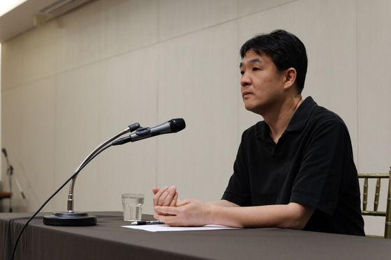 Lee Sung-goo, CEO of virtual boy band Plave's agency and production company Vlast, answers questions from reporters during a press conference held Monday in western Seoul. [VLAST]