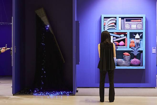 A visitor views artworks on display at Frieze Seoul 2023, held at Coex in Seoul. (Courtesy of Lets Studio and Frieze)