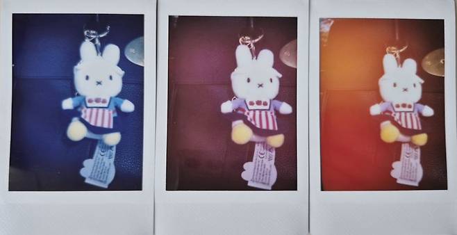 '인스탁스 미니99'로 미피 인형을 라이트 블루(LB), 소프트 마젠타(SM), 빛 누출(LL) 모드로 각각 찍은 결과물(왼쪽부터). 사진=구자윤 기자