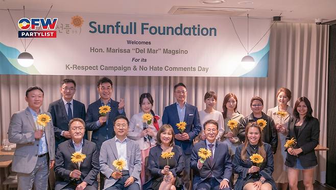 Rep. Marissa Magsino of the Philippine House of Representatives (third from left in the first row) poses for a photo with members of the Sunfull Foundation in Seoul on Tuesday. (Marissa Magsino)