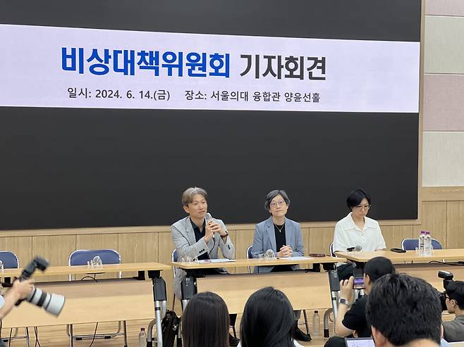 The emergency committee of medical professors at Seoul National University and Seoul National University Hospital speaks at a press conference on the school's campus on Friday. (Park Jun-hee/The Korea Herald)