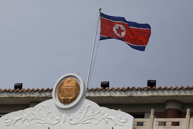 The North Korean flag flutters above the North Korean consular office in Dandong, Liaoning province, China, April 20, 2021. (Reuters)