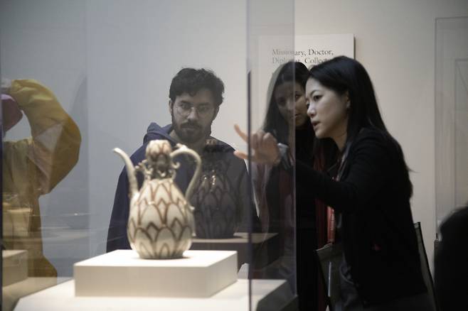 Visitors viewing an object in the Korean gallery (Courtesy of National Museum of Asian Art, Smithsonian Institution)