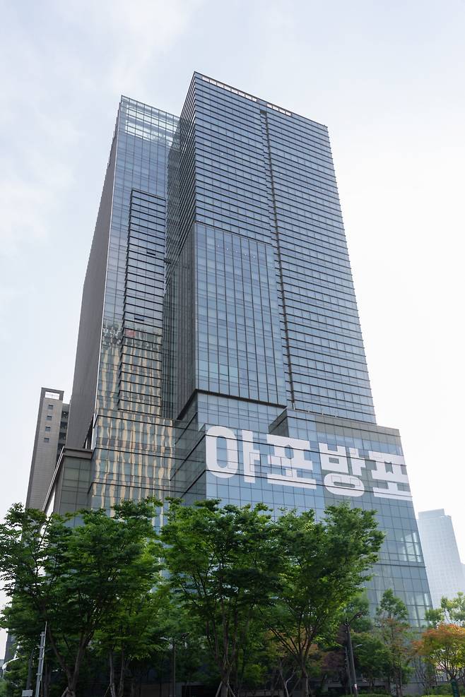 Hybe's headquarters in Yongsan, Seoul, displays a message for BTS fans on its building, abbreviated as "Army Forever, BTS Forever," on June 11. (Hybe)