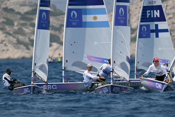 Korea's Ha Jee-min, second from right, competes in Race 4 of the men's dinghy at Paris Olympics in Marseille on Friday.  [AFP/YONHAP]