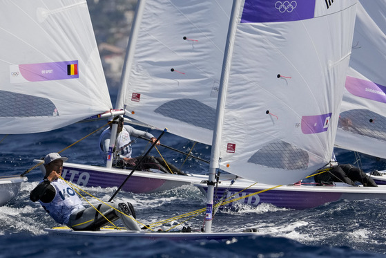 Korean sailor Ha Jee-min, front, participates in a men's dinghy class race during the Paris Olympics on Saturday in Marseille, France. [AP/YONHAP]