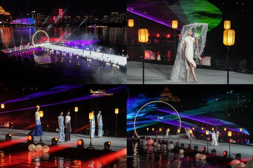 Models perform cheongsam runway shows at the opening ceremony.