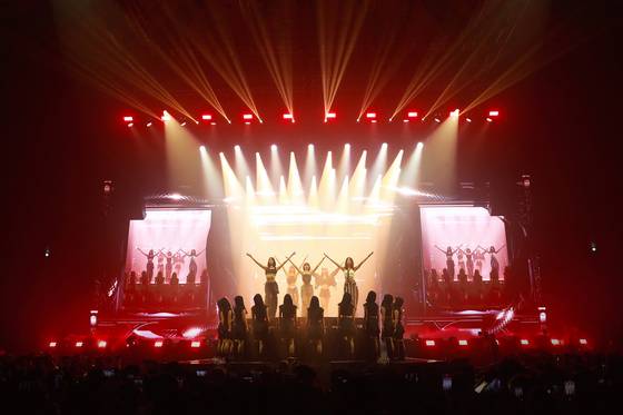 Girl group Le Sserafim during the group's first world tour, ″Flame Rises,″ in August 2023 held at the Jamsil Indoor Stadium. [SOURCE MUSIC]