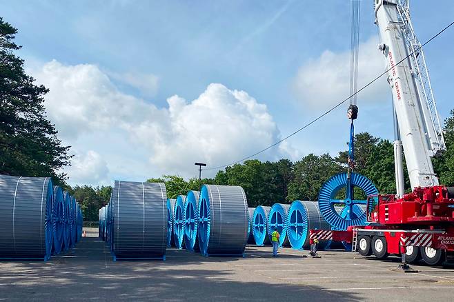 Taihan Cable & Solution employees work on the cable-pulling process at the company’s operating site in the US. (Taihan Cable & Solution)