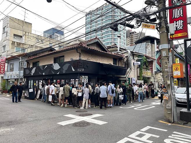 People queue in front of "Namyeong Chicken" in Yongsan, Seoul, on Sept. 21, 2024. /Lee Hai-woon