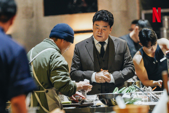 Paik Jong-won as a judge on Netflix's cooking survival show "Culinary Class Wars" [NETFLIX]