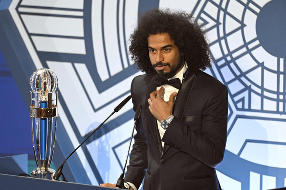 Qatar's forward Akram Afif speaks after receiving the AFC Player of the Year award during the AFC Annual Awards 2023 ceremony Kyung Hee University in eastern Seoul on Tuesday. [AFP/YONHAP]