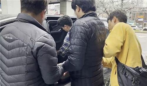 A screen capture from a video shows the arrest of a 40-year-old Seoul National University graduate, surnamed Park, who was sentenced to 10 years in prison for creating and distributing deepfake sexual content on Wednesday. [SEOUL METROPOLITAN POLICE AGENCY]