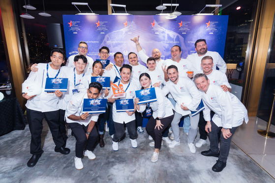 Young chefs and their mentors pose for the camera after the S. Pellegrino Young Chef Academy Competition's awards ceremony at The Murray Hong Kong on Monday. [S.PELLEGRINO YOUNG CHEF ACADEMY]