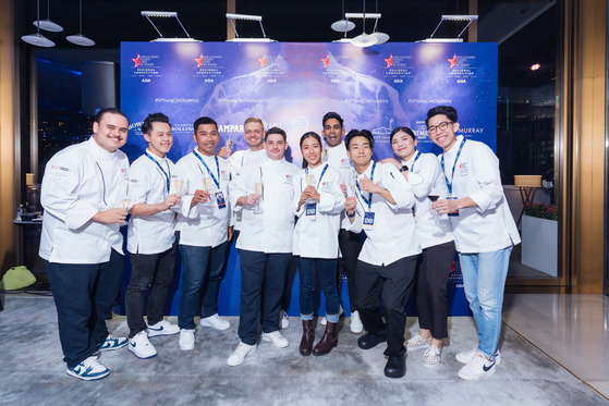 The 10 young chefs who competed in S. Pellegrino's Young Chef Academy Competition pose for a photo after the awards ceremony at The Murray Hong Kong on Monday. Korean chef Kim Jae-ho stands third from the right. [S.PELLEGRINO YOUNG CHEF ACADEMY]