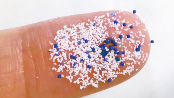 Particles of microplastics are placed on a human finger. [UNITED NATIONS ENVIRONMENT PROGRAMME]