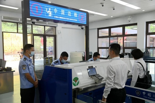 Visitors undergoing border control procedures for heading into the Cooperation Zone