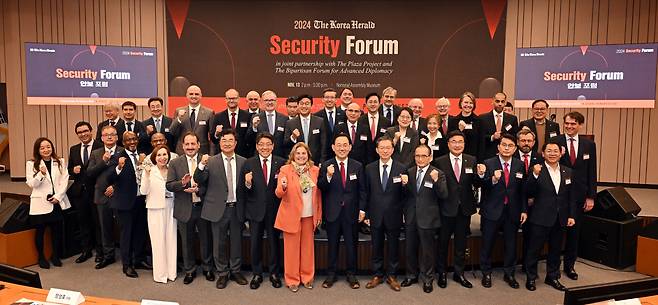 Lawmakers, ambassadors, panelists and speakers pose for a photo at the Korea Herald Security Forum 2024 at the National Assembly Museum in Seoul on Wednesday. (Lee Sang-sub/The Korea Herald)