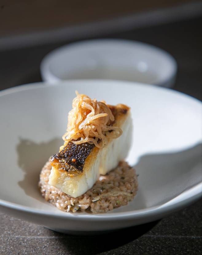 Sea bass dish crafted by Chef Song Hong-yun. /Jang Ryeon-Sung