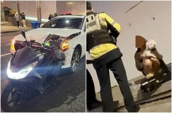 지난 2월 3일 새벽 서울 강남구 논현동에서 DJ 예송 음주운전을 하다 낸 사고 현장에서 강아지를 끌어안고 사고 차량을 지켜보고 있는 모습. 유튜브 ‘카라큘라 미디어’ 캡처