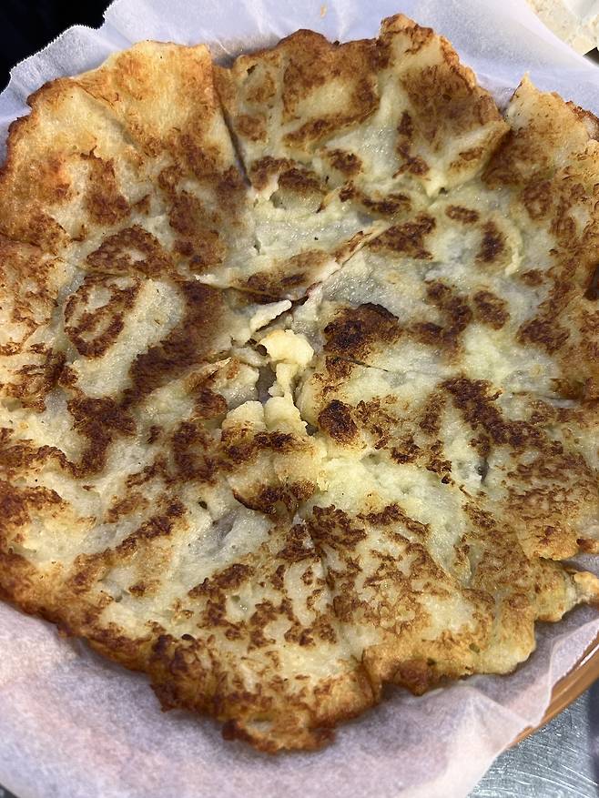 Gamjajeon, or Korean potato pancakes, are served at Baegi Handmade Tofu. (Park Jun-hee/The Korea Herald)