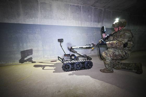 A soldier from the 2nd Infantry Division/South Korean-U.S. Combined Division deploy an unmanned robot to navigate and search a subterranean facility during the South Korea-U.S. underground facility response drill in Paju, Gyeonggi, on March 17, as part of this year's Freedom Shield field training drills. [ROK ARMY]