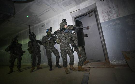 Soldiers from the Capital Mechanized Infantry Division conduct search-and-destroy exercises inside a subterranean training area during the South Korea-U.S. underground facility response drill in Paju, Gyeonggi, on March 17, as part of this year's Freedom Shield field training drills. [ROK ARMY]