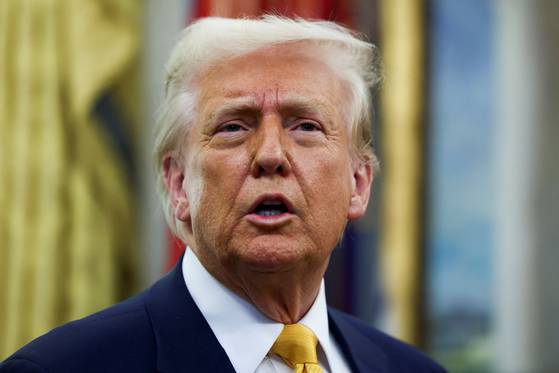 U.S. President Donald Trump speaks in the Oval Office of the White House in Washington on March 7. [REUTERS/YONHAP]