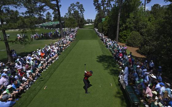 Tiger Woods hits his tee shot on the 18th hole during the final round of the Masters Tournament at Augusta National Golf Club in Augusta, Georgia on April 14, 2024. [GETTY IMAGES]