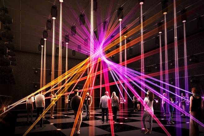 In the first hall of the Korea Pavilion, titled “Everyone Is United by Sound and Light,” beams of light move through the room. (KOTRA)