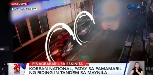 지난달 필리핀 마닐라 말라테구 길거리에서 한국인 A씨에 총격을 가한 강도 4명이 오토바이 2대(흰색 원 안)에 나눠 타고 달아나는 모습. 기사와 직접적인 관련 없음. [사진 = GMA뉴스 유튜브 캡처]