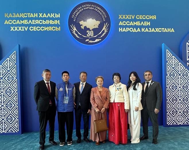 Attendees  pose for a group photo ahead  of the 34th session of the Assembly of the People of Kazakhstan at Palace of Independence in Astana, the capital city of Kazakhstan on Thursday (From the right)  Yuri Shek, Chairman of the Association of Koreans of the Aktobe Region; Natalia Lee, Chief Ballet Master of the State Republican Academic Korean Theater; Lyudmila Lee, Chairperson of the Ethnocultural Association of Koreans of the Atyrau Region; Lyubov Ni, Artistic Director of the State Republican Academic Korean Theater; Roman Kim, Member of the Board of Trustees of the Association of Koreans of Kazakhstan; Denis Kim, Volunteer of the Assembly of the People of Kazakhstan; Konstantin Kim, Editor-in-Chief of the newspaper Koryo Ilbo. (Sanjay Kumar/ The Korea Herald)