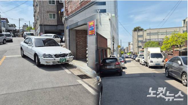 지난 27일 전북 익산시 창인동 신천지 익산교회 인근. 모퉁이에 주차된 차와 주차구역이 아닌 곳에 주차된 차들이 통행을 방해하고 있다. 심동훈 기자
