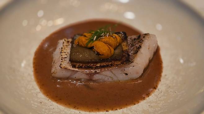 Sea urchin chiboust, tilefish fillet, and gratin toast. /STAY Seoul