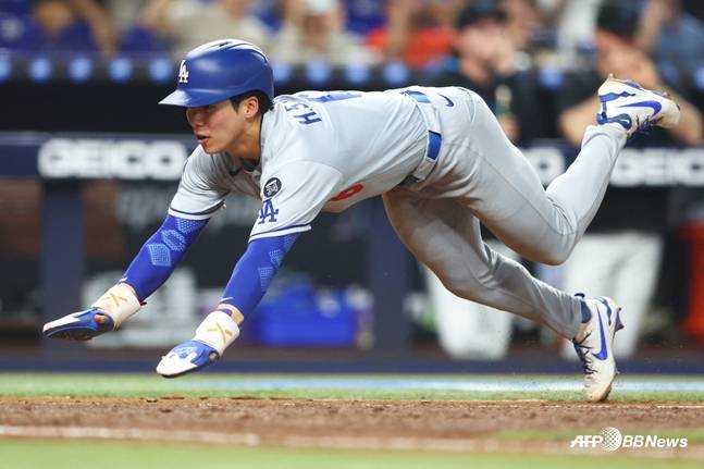 7일 경기에서 오타니의 적시타로 홈을 파고드는 김혜성의 모습. /AFPBBNews=뉴스1