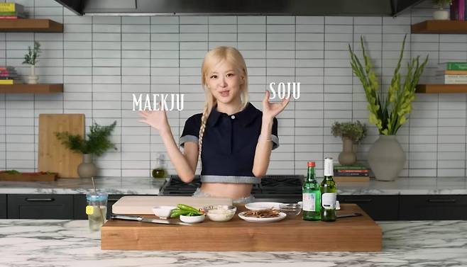 Rose of Blackpink introduces somaek, a fusion of soju and beer, as her favorite liquor in celebration of her new single ″Apt.″ during an interview with Vogue. [SCREEN CAPTURE]